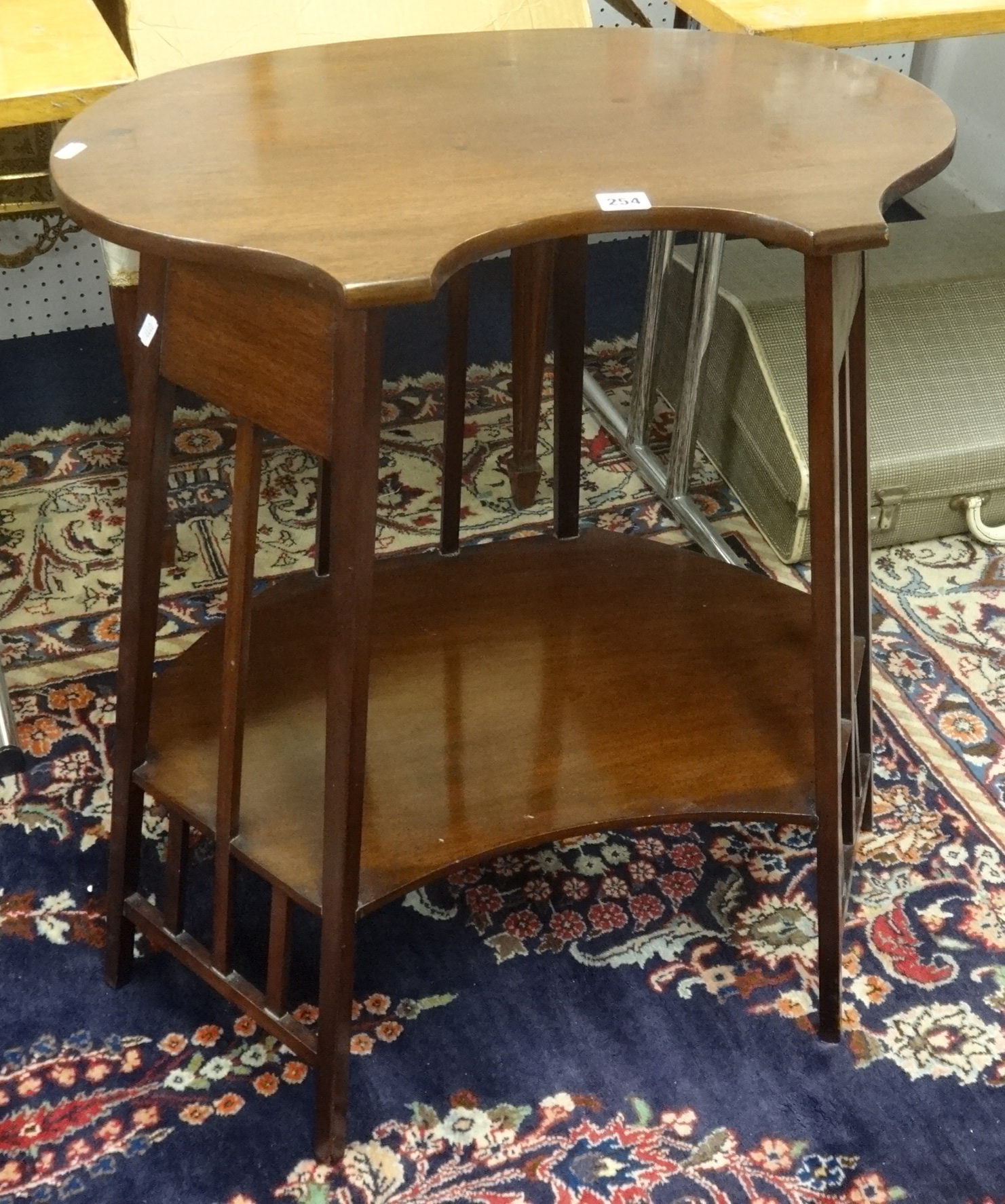 A mahogany arts and crafts style two tier occasional table.