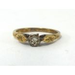 A 9ct ring set with a single diamond.