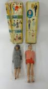 Vintage Ken and Barbie dolls by Mattel (boxed).