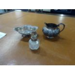 A silver mounted scent bottle, white metal cream jug no markings possibly Chinese and a silver and