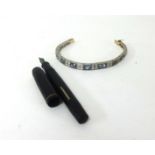 A bracelet set with sapphire and diamond effect stones together with a fountain pen, Unique