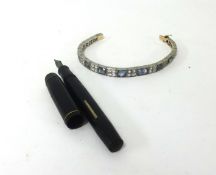 A bracelet set with sapphire and diamond effect stones together with a fountain pen, Unique