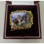 An antique gold and porcelain brooch decorated with a child and companion together with an oil