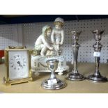 A box set of vintage nursery teawares, three silver candlesticks, modern carriage clock and