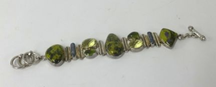 A peridot and pearl affect fashion bracelet.