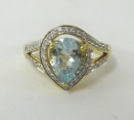 An 18ct yellow gold aqua marine and diamond set ring.