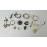 A bag of mixed jewellery including bangles, objects, brooches etc.