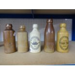 Nine old ginger beer bottles including South Hams Mineral Water Company, Harbourne Home Brewers,