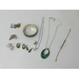 A mix of general jewellery including bangles, brooches, necklaces and bracelets.