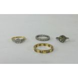 Four rings including 18ct and platinum diamond set dress ring and a 9ct diamond set keepers ring