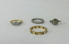 Four rings including 18ct and platinum diamond set dress ring and a 9ct diamond set keepers ring