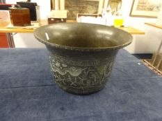 An oriental possibly Chinese bronze censer/planter with detached base decorated with six character