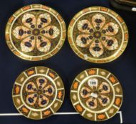 Royal Crown Derby, four patterned porcelain plates.