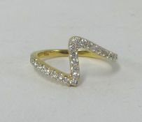 An 18ct yellow gold diamond zig zag ring.