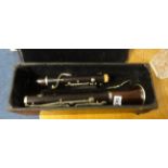 A rosewood cased clarinet, boxed.