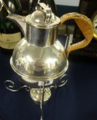 A stylish silver plated picnic kettle on stand with spirit burner.