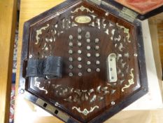A Wheatstone concertina, 48 buttons, no.11394 with pierced rosewood fretwork in original hexagonal