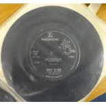 A collection of Beatles 45 rpm single records.