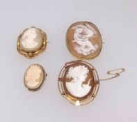 A 9ct cameo brooch decorated with a figure and bird, another 9ct cameo brooch and two others (4).