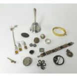 A bag of mixed jewellery, silver bell, gilt bangle and other jewellery.