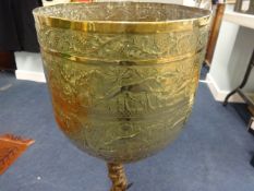 An unusual brass jardinière mounted on an antler base.