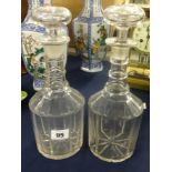 A pair of three ring glass decanters and stoppers, height 28cm.