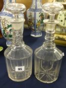 A pair of three ring glass decanters and stoppers, height 28cm.