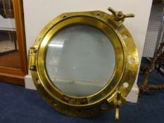 A solid brass Port Hole of HMS Ark Royal (1955-1978) with certificate of origin, 21 1/2 inches