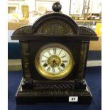 A Victorian wood cased architectural eight day clock with key.