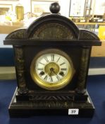 A Victorian wood cased architectural eight day clock with key.