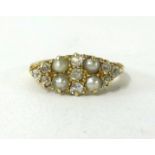 An antique 18ct gold pearl and diamond ring.
