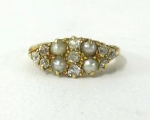 An antique 18ct gold pearl and diamond ring.