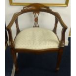Two mahogany framed elbow chairs with round backs.