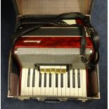A Sorrento piano accordion, cased.