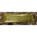 A large Middle Eastern brass handled tray, overall length 102cm.