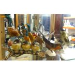 A collection of Beswick and other porcelain small birds (10).