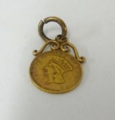 A small United States gold cent as a pendant.