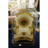 A 19th Century French alabaster and gilt mantle clock decorated with winged figures, coloured dial