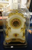 A 19th Century French alabaster and gilt mantle clock decorated with winged figures, coloured dial