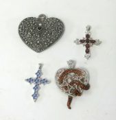 A collection of four fashion jewellery pendants.