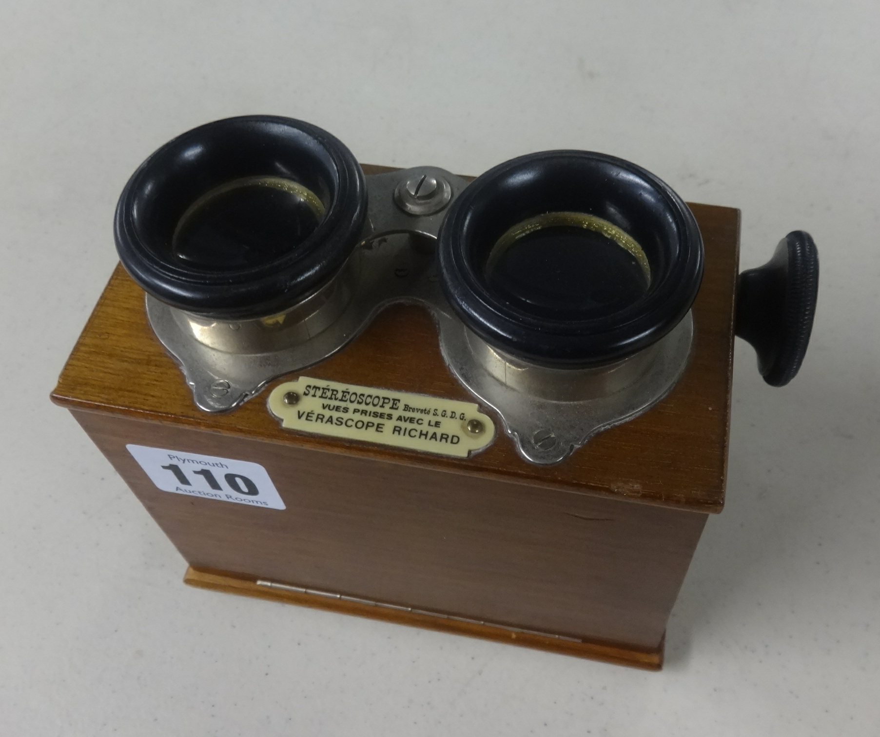 A stereoscope boxed viewer and slides.