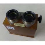 A stereoscope boxed viewer and slides.