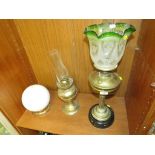 BRASS OIL LAMP ON PLINTH WITH ETCHED GREEN GLASS SHADE, ONE OTHER BRASS OIL LAMP AND OPAQUE GLOBE