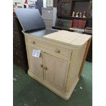 CONTEMPORARY LIGHT WOOD CABINET WITH FOLDING TOP AND SINGLE DRAWER OVER TWO CUPBOARD DOORS