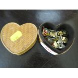 THREE ENAMEL GOLLY BADGES, TWEETY PIE LAPEL BROOCH AND BASE METAL CUFFLINKS IN HEART SHAPED BOX