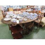 VERY LARGE OVAL ELM GATE-LEG DINING TABLE ON BALUSTER TURNED LEGS AND SIX ELM LADDER-BACK CHAIRS