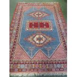 LARGE VIBRANT LIGHT BLUE, RED AND CREAM GROUND SIX MARGIN RECTANGULAR FLOOR RUG WITH CENTRAL