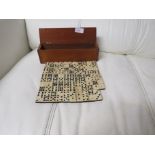 EBONY AND BONE DOMINOES IN WOODEN BOX