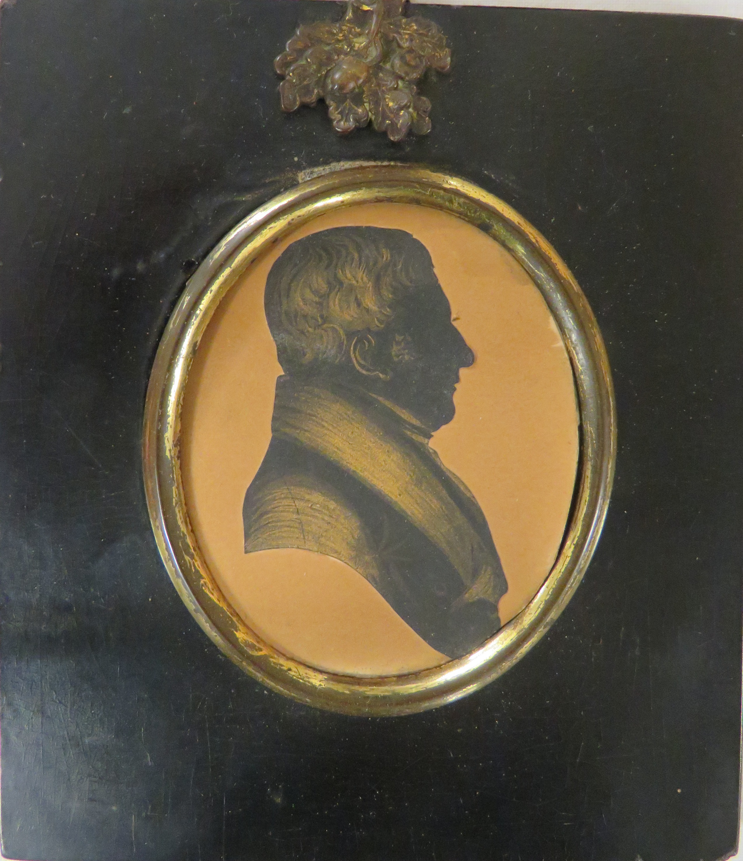 Painted oval portrait miniature of gentleman, head and shoulders enhance silhouette, signed to