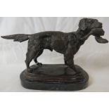 A bronze figure of retriever dog with duck, on a black marble plinth, overall height 15cm, length